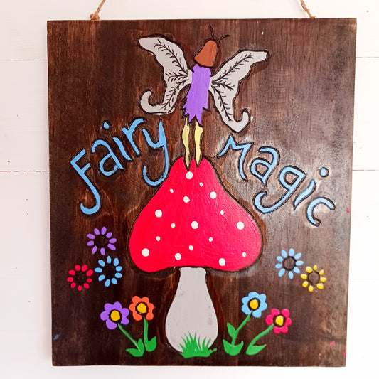 Bring a touch of enchantment to your home with this Fairy Magic Handmade Wall Plaque. Beautifully crafted and hand-painted, it features a delightful fairy resting among whimsical mushrooms, perfect for adding charm and colour to any space. Whether displayed indoors or outdoors, this rustic fairy wall art will brighten your surroundings and spark a little magic every day.