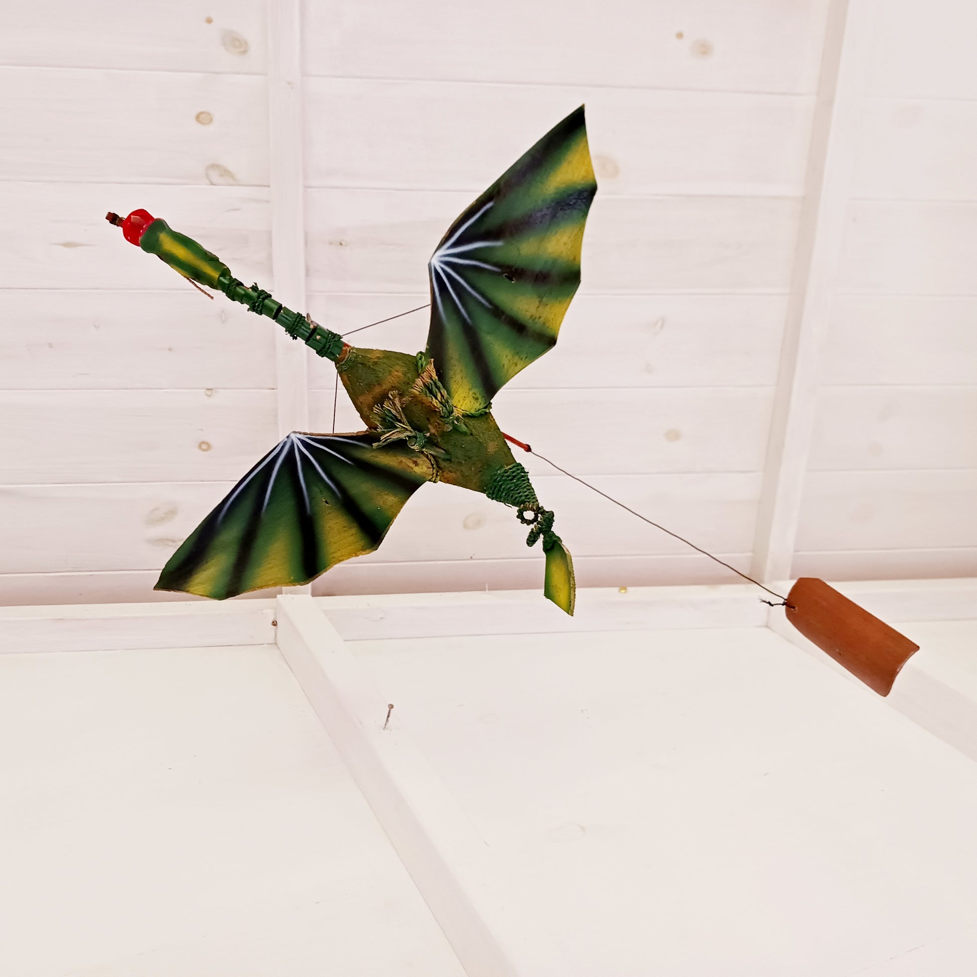 Bring a touch of magic and movement to your home or garden with this Large Green Coconut Dragon Mobile, a beautifully handcrafted decorative piece handmade in Indonesia.