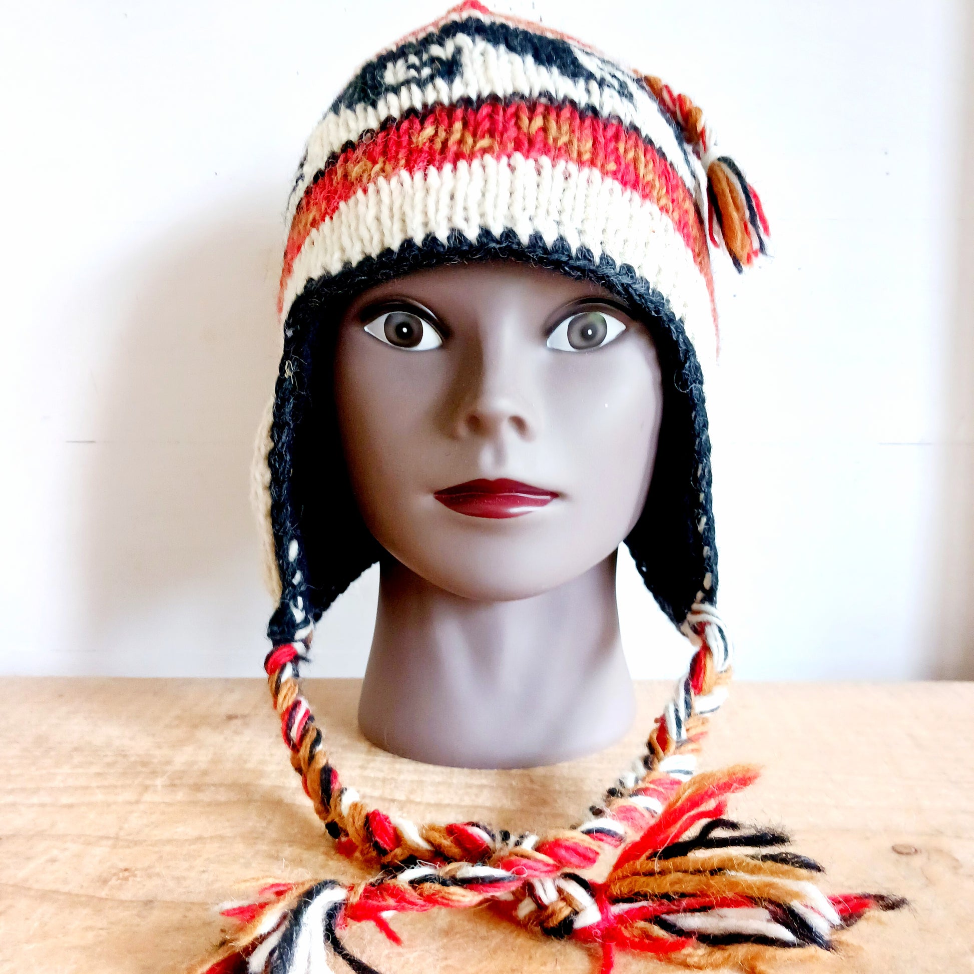 Stay cozy and stylish with our handmade chunky wool earflap hats, crafted in Nepal by skilled women artisans in Kathmandu. Each hat is 100% pure wool and features a soft polar fleece lining for extra warmth and comfort. Perfect for cold winter days, outdoor adventures, or adding a touch of handmade charm to your look.