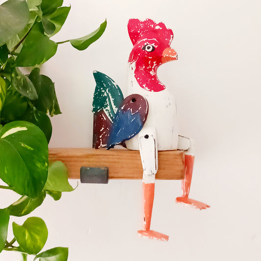 Transform any room into a cosy, farmhouse-inspired space with our Sitting Chicken Shelf Decor. This delightful piece features a bright, painted distressed finish that brings warmth and character to any setting. 