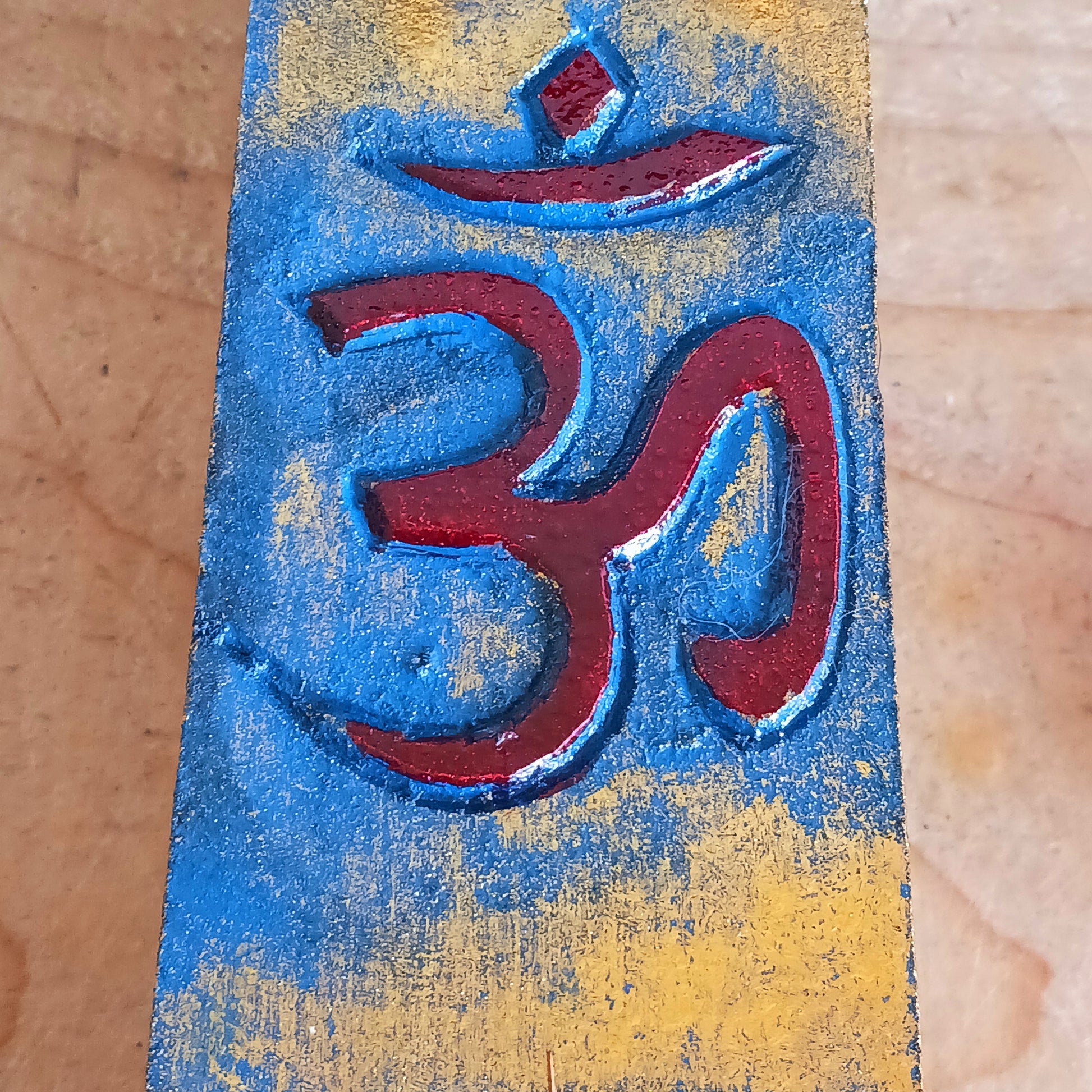 This unique incense stick holder is perfect to catch the ash from your favourite incense. It has been handmade from responsibly sourced wood, skillfully carved and decorated with a centre OM symbol.