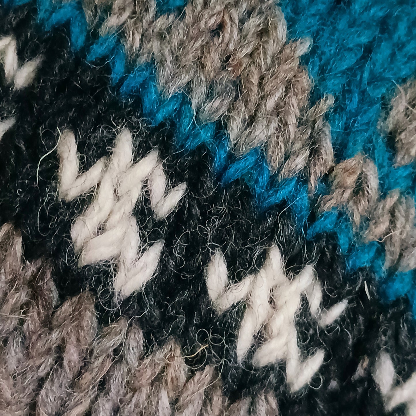 Stay cozy and stylish with our handmade chunky wool earflap hats, crafted in Nepal by skilled women artisans in Kathmandu. Each hat is 100% pure wool and features a soft polar fleece lining for extra warmth and comfort. Perfect for cold winter days, outdoor adventures, or adding a touch of handmade charm to your look.