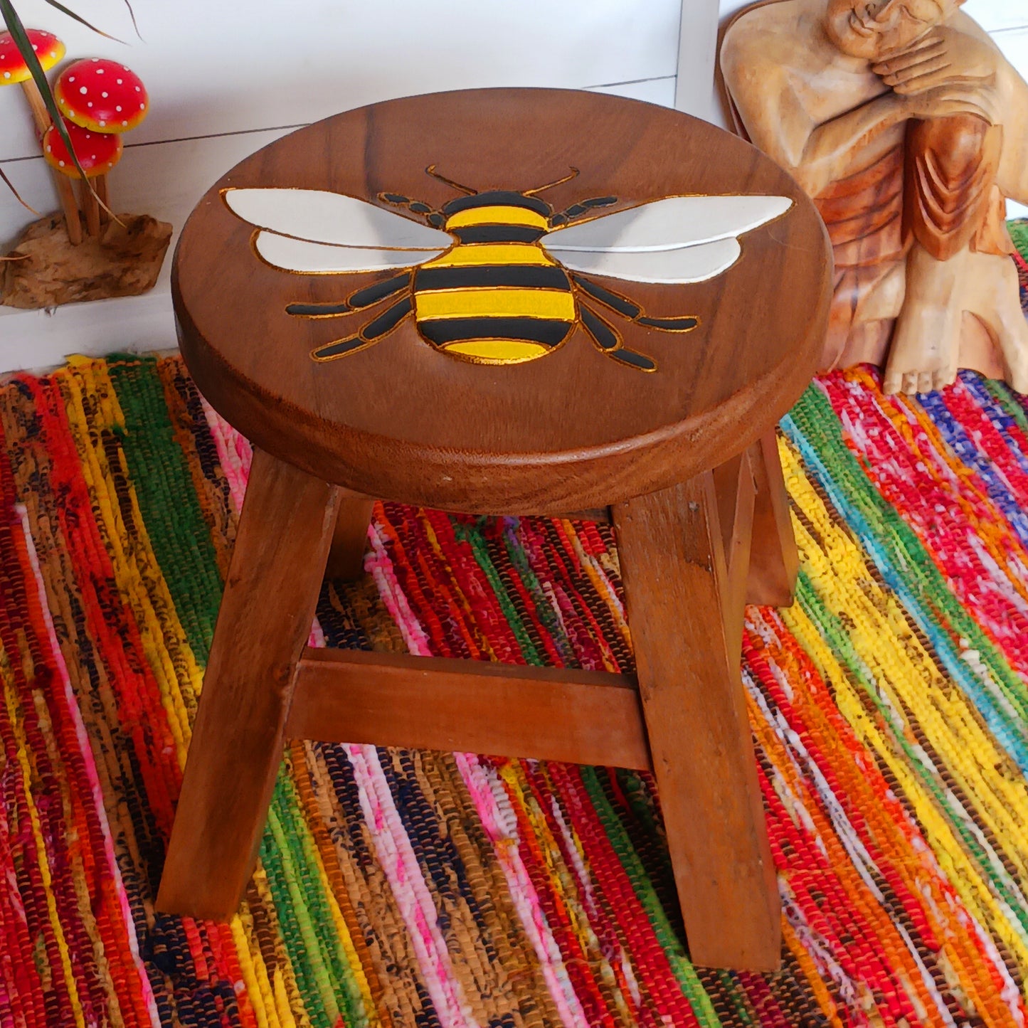 Bring a cheerful touch of handmade charm to your home with this beautiful Fairtrade carved wooden bumble bee stool, lovingly handcrafted and painted by skilled artisans in Thailand.