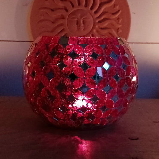 Add a warm, colourful glow to your home with this large and beautiful handmade Meena mosaic glass tealight holder, crafted by a World Fair Trade Organisation (WFTO) approved supplier in India.