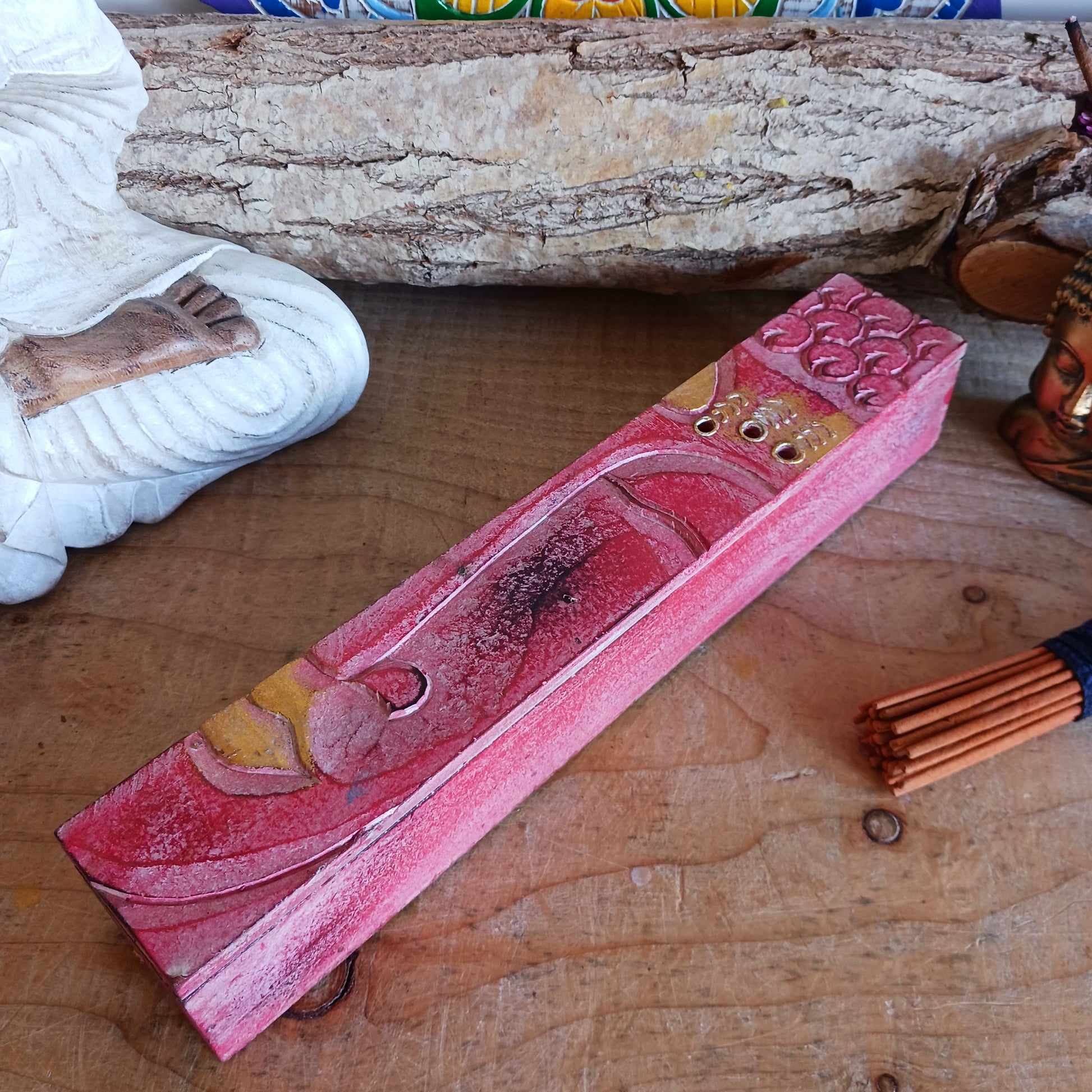 This unique incense stick holder is perfect to catch the ash from your favourite incense. It has been handmade from responsibly sourced wood and beautifully decorated with a handcarved Buddha head.
