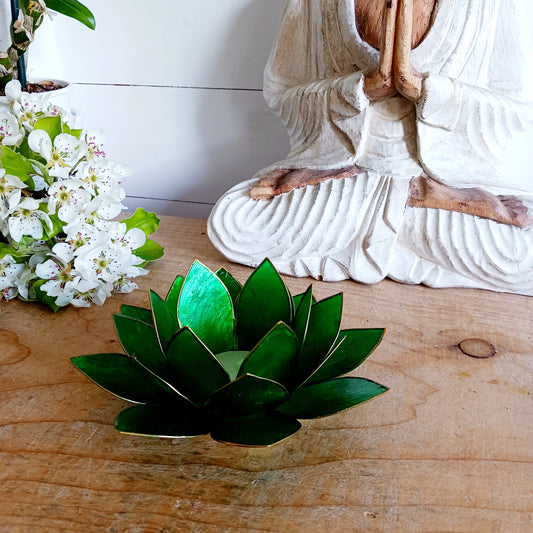 The Lotus Flower is a symbol of achieving enlightenment, peacefulness and spirituality. This beautiful candle holder can be fitted with tealight candles or slightly larger candles. The diameter of the middle is roughly 5.5cm, so it will fit any candle with the same diameter.