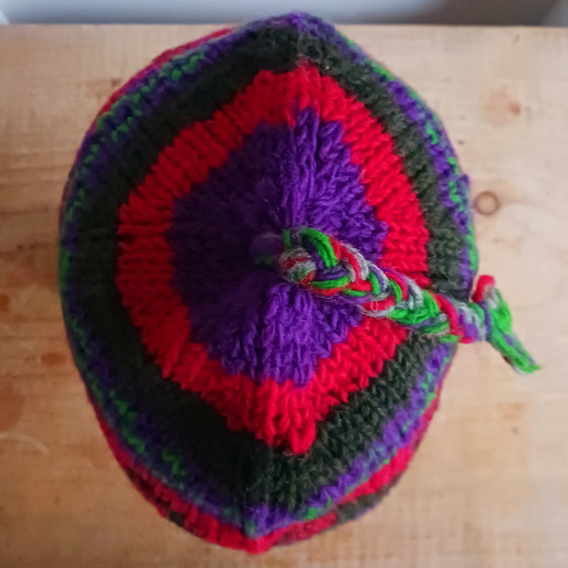 Stay cozy and stylish with our handmade chunky wool earflap hats, crafted in Nepal by skilled women artisans in Kathmandu. Each hat is 100% pure wool and features a soft polar fleece lining for extra warmth and comfort. Perfect for cold winter days, outdoor adventures, or adding a touch of handmade charm to your look.