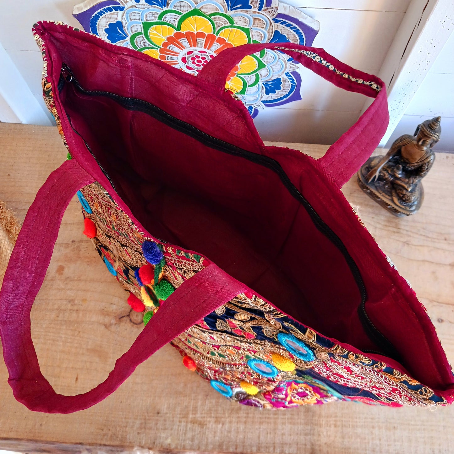 This beautiful large Indian bag comes with a wide shoulder strap and plenty of space inside for your personal items. In a patchwork style design, this bag is intricately embroidered with a traditional bohemian pattern. The bag is fully lined throughout.