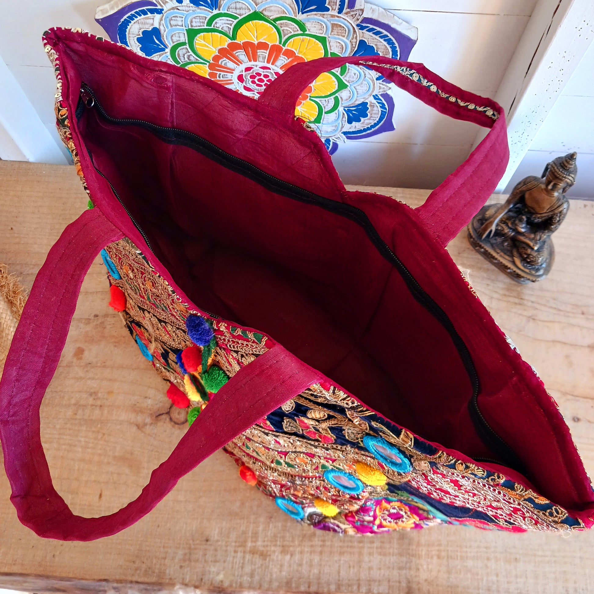 This beautiful large Indian bag comes with a wide shoulder strap and plenty of space inside for your personal items. In a patchwork style design, this bag is intricately embroidered with a traditional bohemian pattern. The bag is fully lined throughout.