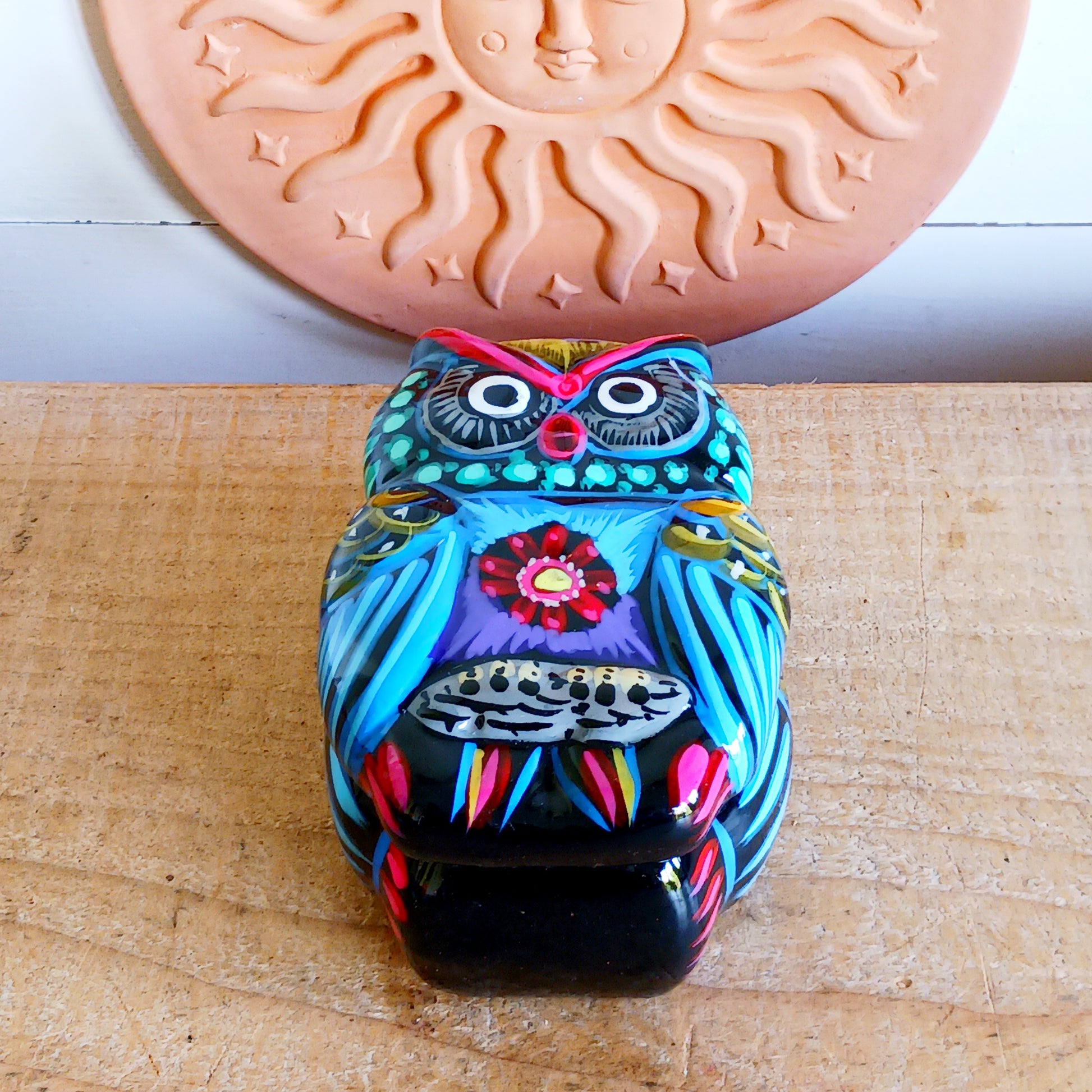 Bring a burst of colour and culture into your home with this beautifully hand-painted owl trinket pot, a unique piece that blends functionality with traditional artistry.