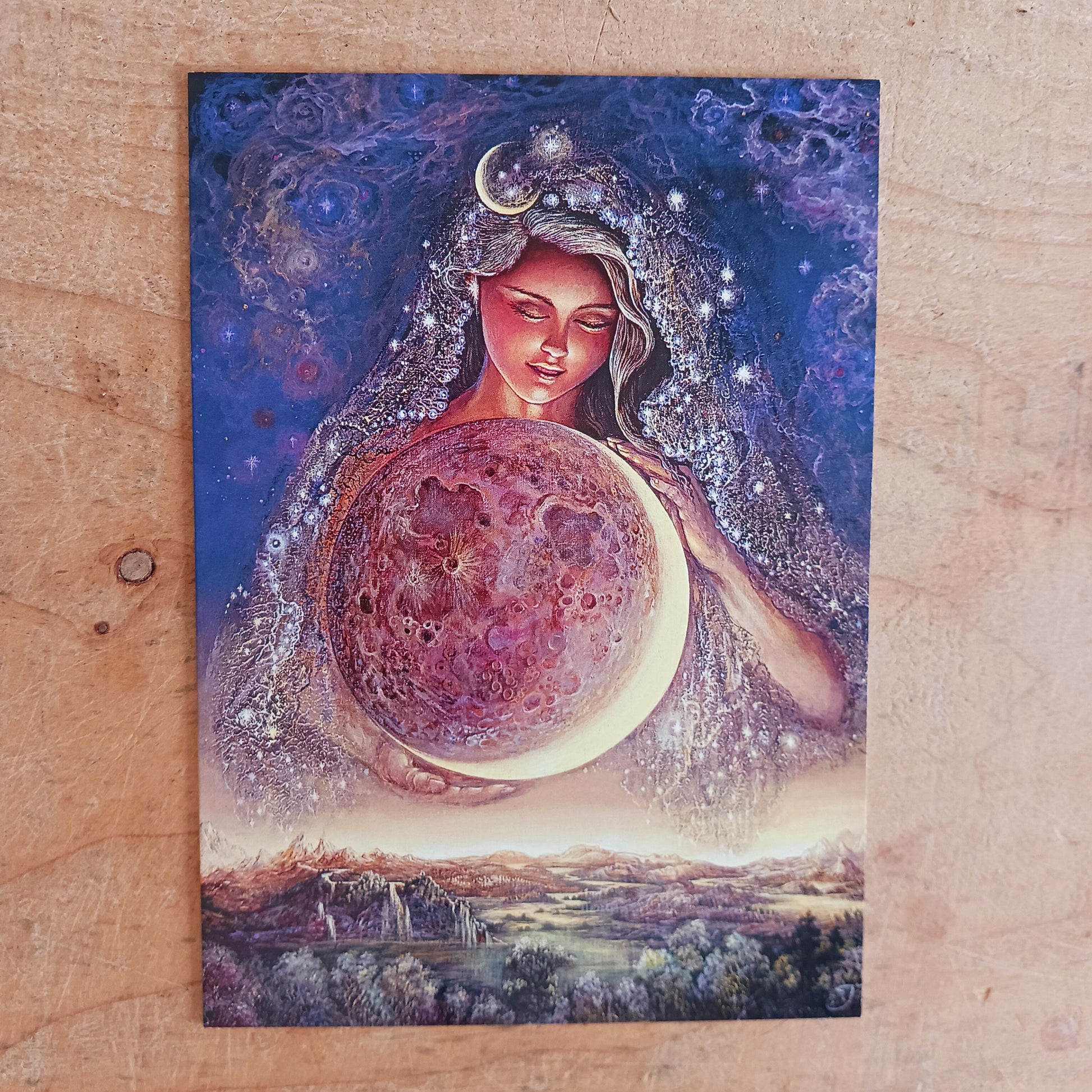 This beautiful greetings card entitled Moon Goddess is designed by Josephine Wall. The card is blank inside for you to write your own message. Each envelope is decorated with pretty artwork too. Perfect for any occasion.