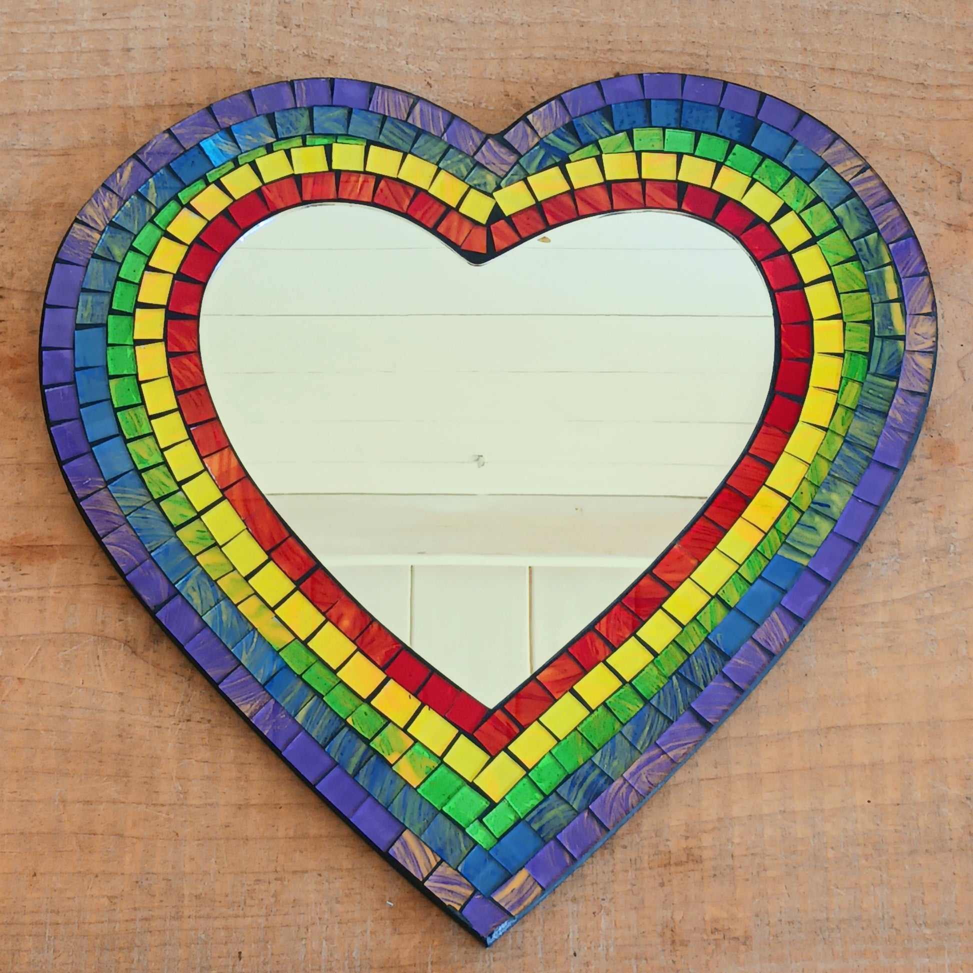 Decorate your home with a Rainbow Mosaic Heart Wall Mirror. A colourful decorative mirror perfect for bedrooms, living rooms, nurseries and unique gifts.