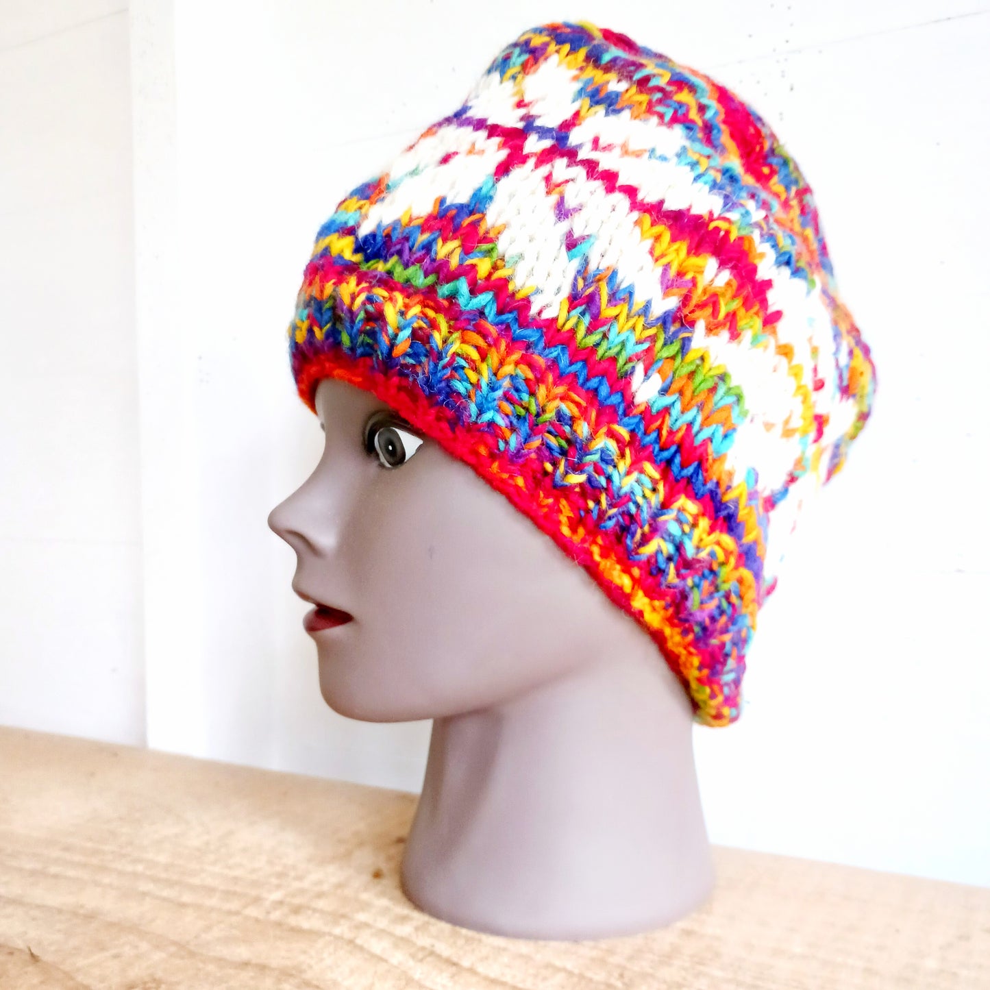Chunky wool beanie hats hand made in Nepal with fleece lining for extra warmth and comfort, this handmade hat is awesomely warm. These knitted beanie hats have a rolled brim, a warm lined interior and are available in mixed colours.