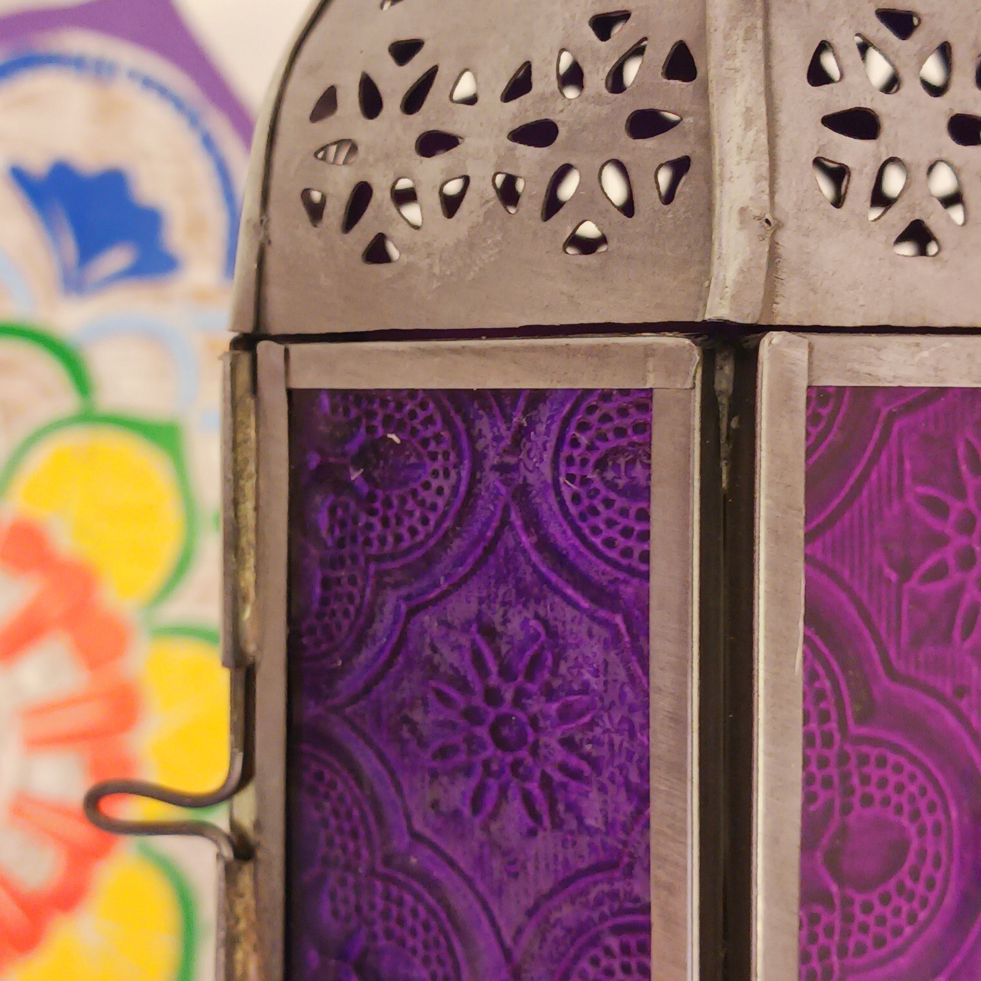 These small glass lanterns come in wonderful colours, featuring an intricate embossed pattern. They have a small hinged door that closes with a sliding catch. The small handle on the top is great for hanging the lanterns around your home. Perfect for adding a touch of warmth to your space.