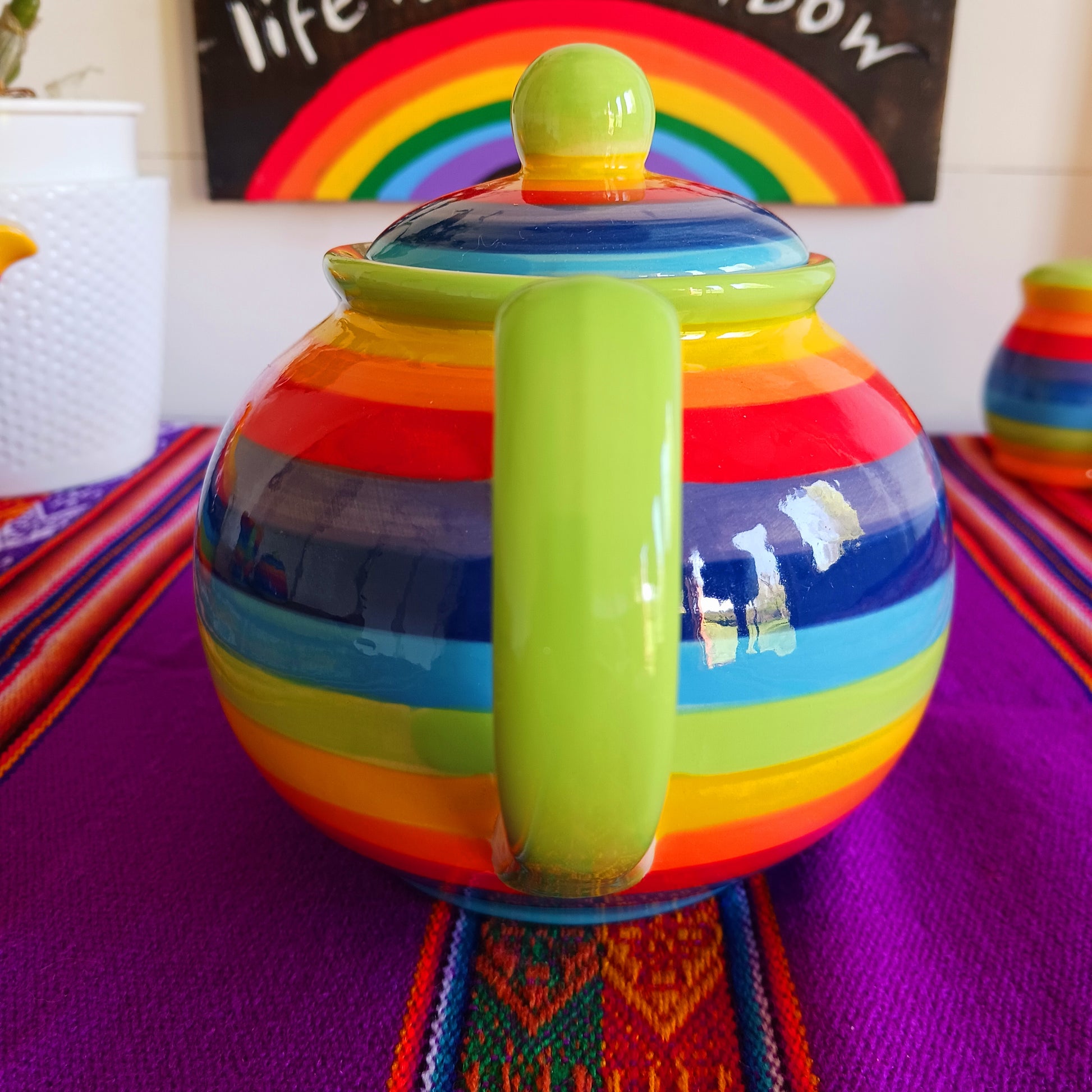 Experience the perfect fusion of artistry and functionality with this exquisite 2-cup ceramic teapot from Thailand. Handcrafted by skilled artisans, this vibrant teapot features a stunning rainbow stripe, adding a pop of colour and charm to your tea rituals.