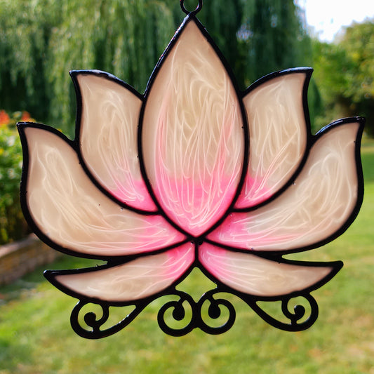 Bring a touch of tranquility to your space with this beautifully crafted lotus flower window hanger. Made from coloured glass and outlined in sleek metal framing, this piece combines simplicity and elegance. When sunlight passes through, it creates a radiant, uplifting display of colour. Hang it in any window to inspire peace, mindfulness, and beauty in your home or workspace.