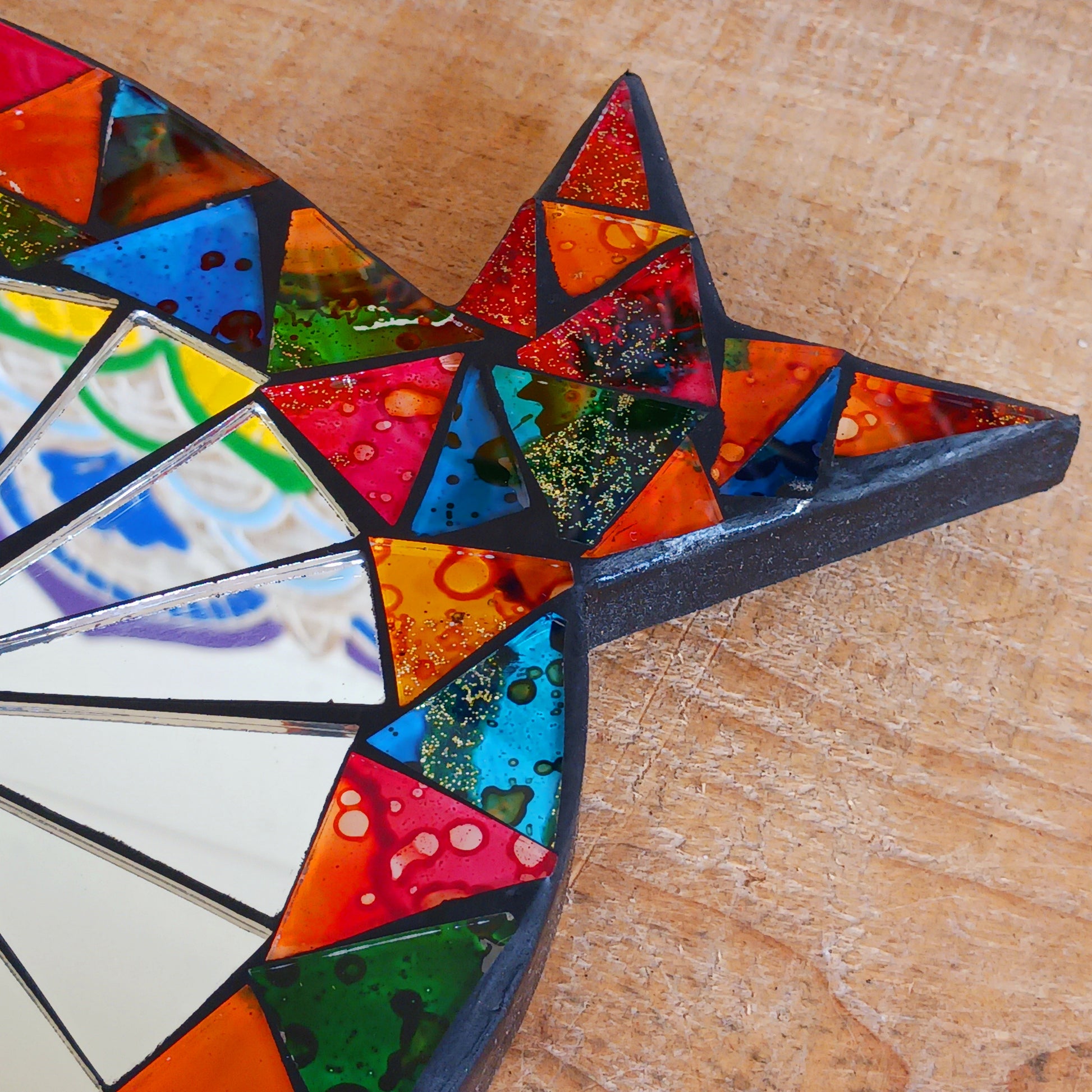 Bring colour, charm, and character to your home with this beautiful Sweet Mosaic Owl Mirror. Handcrafted under fair trade practices, this unique piece features a vibrant, multi-coloured mosaic owl surrounding a functional mirror. Perfect for brightening hallways, bedrooms, or living spaces, this decorative mirror blends artistry with practicality.