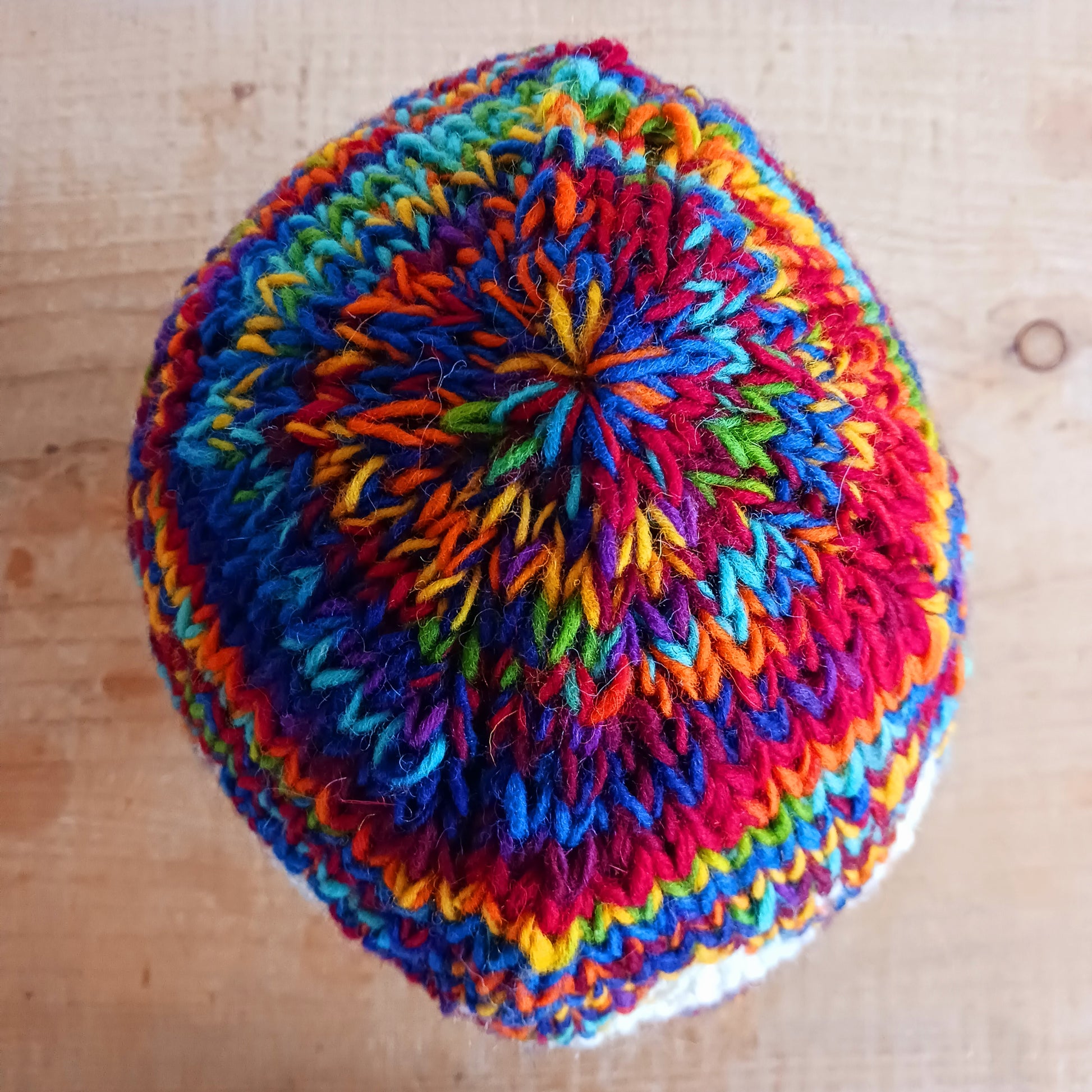 Chunky wool beanie hats hand made in Nepal with fleece lining for extra warmth and comfort, this handmade hat is awesomely warm. These knitted beanie hats have a rolled brim, a warm lined interior and are available in mixed colours.