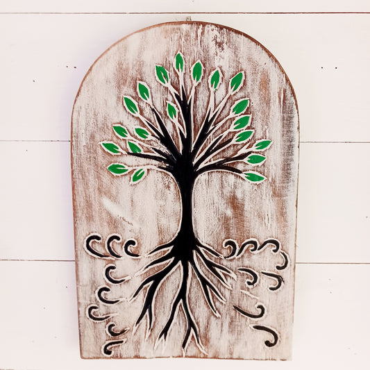 Bring meaningful symbolism and artisan beauty into your space with this chunky hand-carved wood plaque from Bali, Indonesia. Carefully crafted and painted by skilled artisans, this decorative piece features intricate etchings of the Tree of Life, a universal symbol found in many cultures and spiritual traditions.