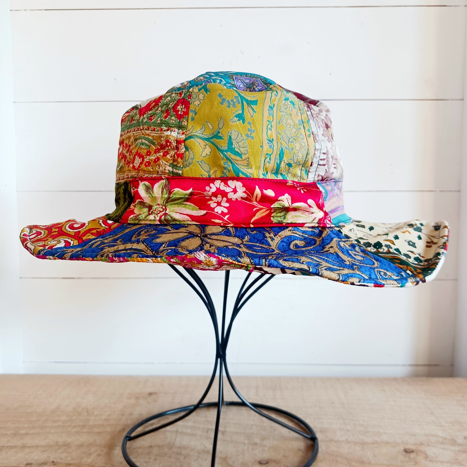 A swell little number for festivals and summer times, you'll look the coolest in this recycled sari patchwork sun hat. Black polyester lined, with a slightly flexible brim for adjusting the shape.