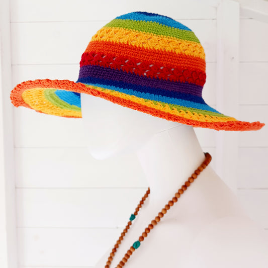 Brighten up your summer with this vibrant handmade crochet cotton sun hat! Featuring a stunning rainbow pattern, this unique hat is perfect for holidays, beach days, and festivals. A malleable wire is carefully woven into the rim, allowing you to shape the brim just how you like it. Lightweight and breathable, it's ideal for sunny adventures. Each hat is individually handcrafted, so you’ll receive the exact one pictured – a one-of-a-kind accessory to celebrate the season in style.