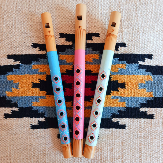 Introduce your little ones to the joy of music with these handcrafted pastel bamboo flutes. Available in three pretty colours, these fair trade instruments are an affordable and eco-friendly way to spark creativity, encourage musical play, and provide a delightful alternative to screen time. Each flute is carefully made from natural bamboo and hand-painted by skilled artisans, making every piece unique. Perfect as a gift or as a fun addition to your child’s toy collection.