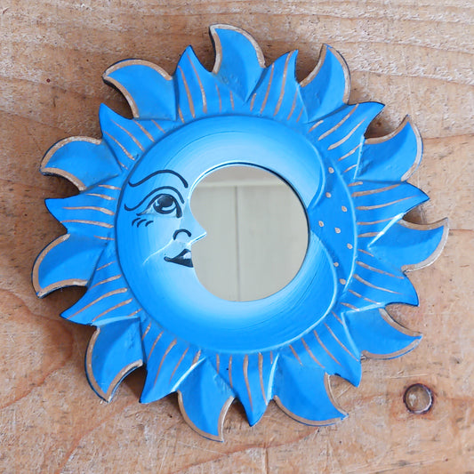 Elevate your home with our Little Sun &amp; Moon Mirror, a mystical and spiritual accent handmade by fairtrade artisans. Featuring an enchanting sun and moon design, this unique piece brings positive energy, balance, and harmony into any space. Perfect for adding a touch of celestial charm to your walls, this mirror doubles as meaningful décor and a symbol of light and reflection.