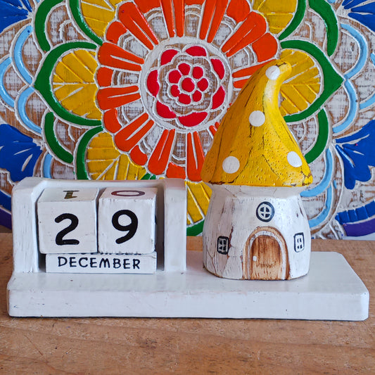Bring a sprinkle of magic to your everyday routine with the Mushroom House Wooden Calendar. Crafted from lightweight, durable wood, this enchanting piece combines functionality with fairy-tale charm. Each day, simply rotate the wooden blocks to keep track of the date—no need for replacements, making it a timeless addition to your home or office.