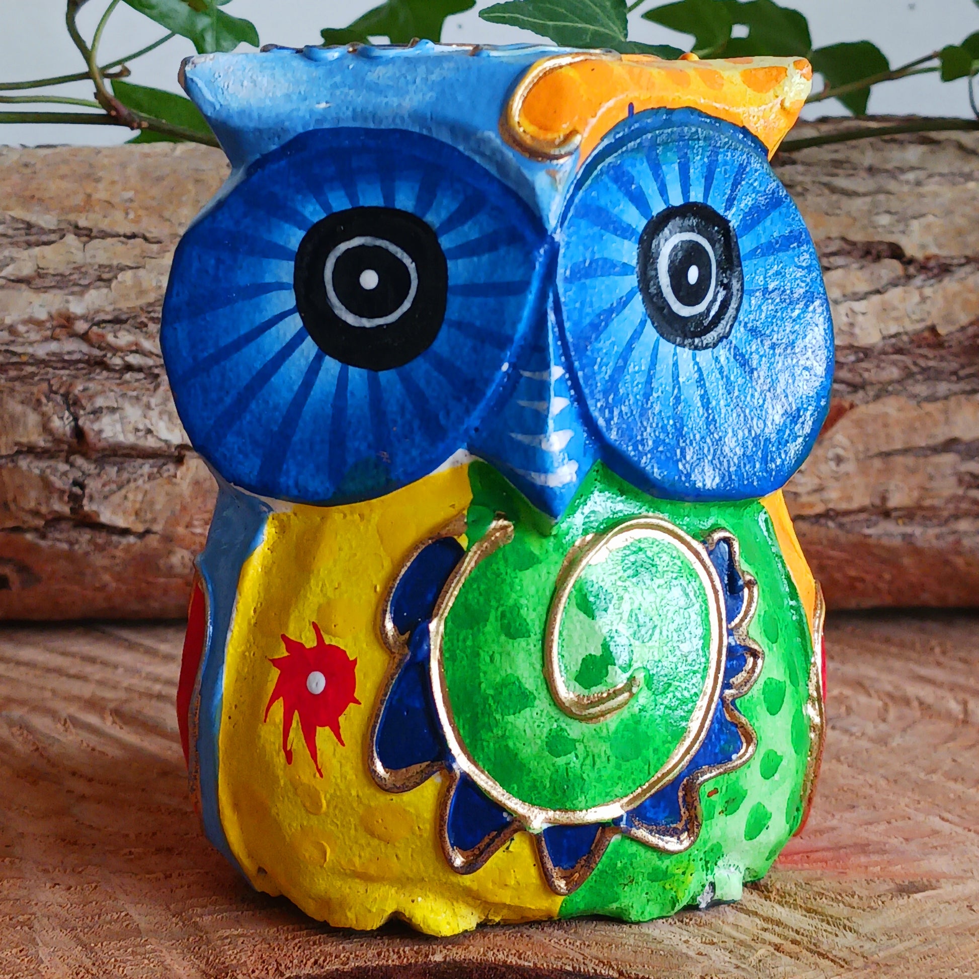 Add a pop of colour to your home décor with these beautifully hand painted Psychedelic Owls. These vibrant and quirky owl figurines instantly brighten any room with their playful charm.