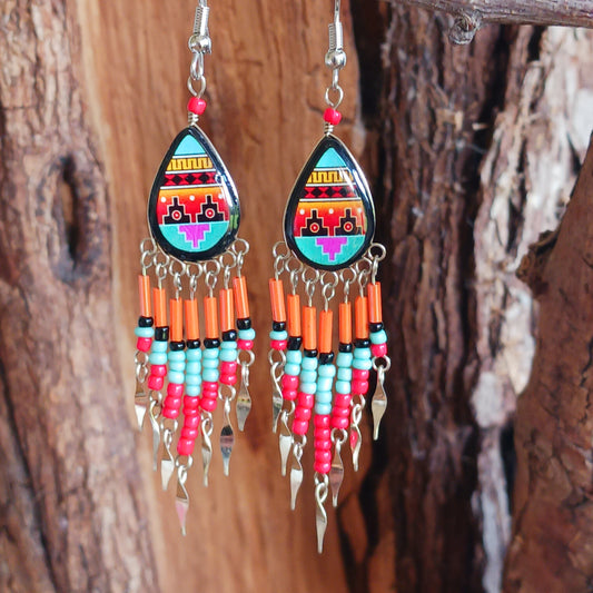 Add a touch of artisan elegance to your jewellery collection with these stunning handmade Peruvian Incan teardrop earrings. Carefully crafted in small family-run workshops in Peru, these eye-catching earrings feature traditional Incan-inspired patterns on the front with a contrasting black reverse for a striking finish.