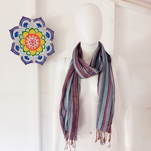 Immerse yourself in the alluring world of bohemian fashion with this delicate Indian Boho Scarf. Crafted with care, each scarf captures the essence of India's free-spirited charm, adding a touch of Boho elegance to your outfit.