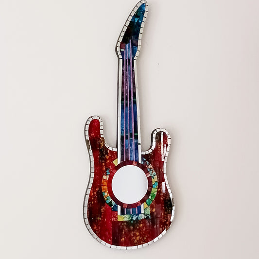 Handcrafted from shimmering, individually placed glass tiles, this stunning guitar-shaped glass mosaic mirror blends creativity, rhythm, and craftsmanship into one striking wall décor accent.
