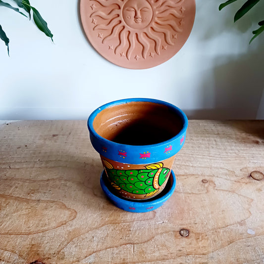 These cute little flower pot and tray sets are hand painted in Madhyapur, Thimi, just outside Kathmandu. Each piece is made in the traditional brightly coloured painting style from Mithila region. Ideal for brightening up your houseplants, or as a gift for family and friends