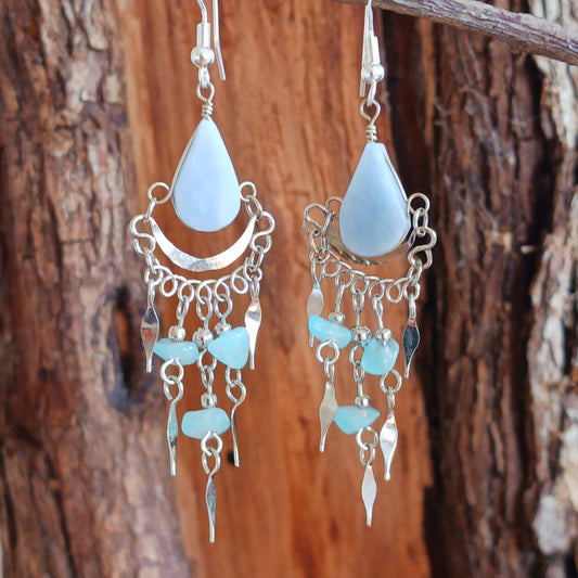 Add a touch of bohemian beauty to your look with these handmade Peruvian stone earrings. Featuring pale blue stones and finished with silver-plated hooks, each pair is carefully crafted in small workshops in Peru.