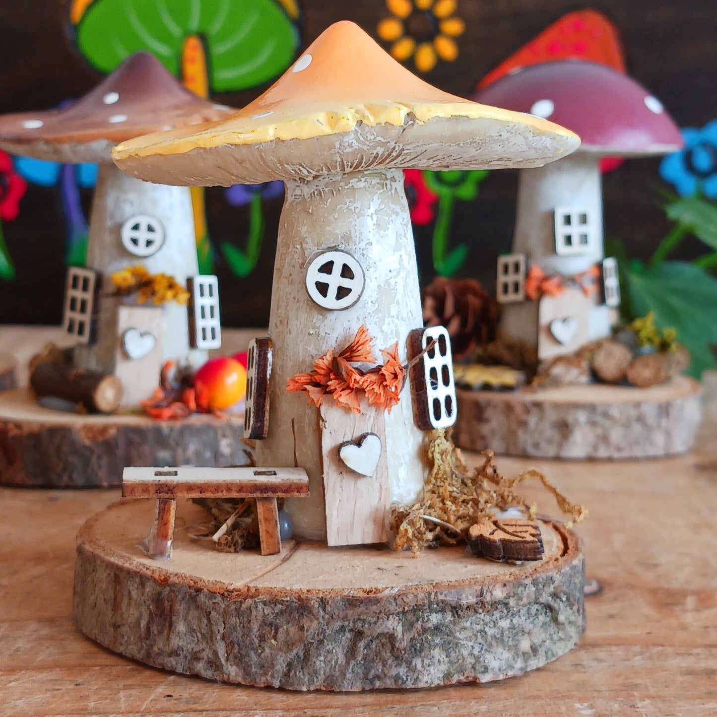 Add a whimsical touch to your home with these charming folk art mushroom cottages. Perfect for all occasions, these handcrafted ornaments are made from high-quality polystone and wood, featuring delightful details and a rustic base made from natural wood slices. Whether placed on a shelf, desk, or windowsill, these miniature cottages bring warmth and personality to any space. Ideal for gifting or as a unique addition to your home décor collection.
