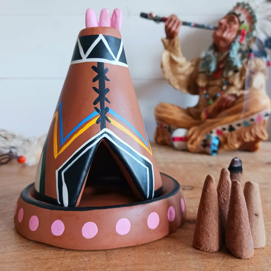 Elevate your incense game with our Clay Tipi Incense Holder.&nbsp;This unique piece has been lovingly handmade and is fairtrade, bringing a touch of charm and authenticity to your home.&nbsp; This quirky tipi design not only catches ash neatly but also adds a playful, earthy vibe to any space. Perfect for meditation, relaxation, or simply creating good vibes and maybe a few smoke signals!