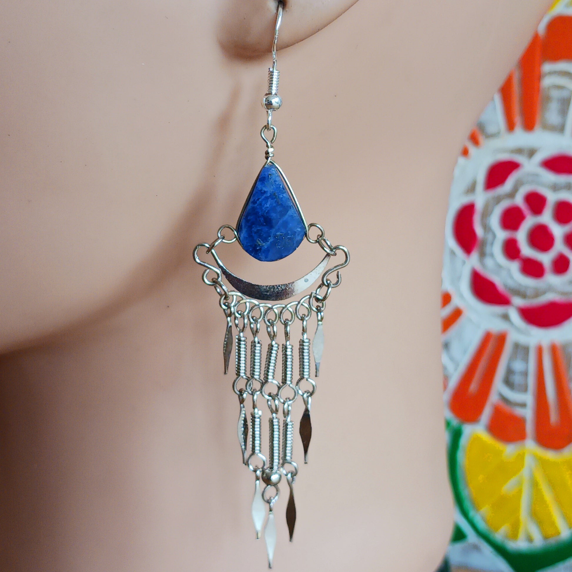 Add a touch of bohemian beauty to your look with these handmade Peruvian stone earrings. Featuring lapis lazuli stones and finished with silver-plated hooks, each pair is carefully crafted in small workshops in Peru.