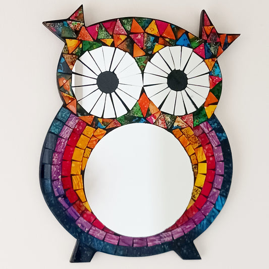 Bring colour, charm, and character to your home with this beautiful Sweet Mosaic Owl Mirror. Handcrafted under fair trade practices, this unique piece features a vibrant, multi-coloured mosaic owl surrounding a functional mirror. Perfect for brightening hallways, bedrooms, or living spaces, this decorative mirror blends artistry with practicality.