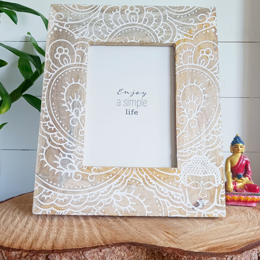 Made in India from sustainably sourced mango wood, these lovely picture frames bring warmth, character, and meaning to any space. Each one is carefully carved or painted with spiritual and cultural designs that go beyond decoration holding deep symbolism and tradition. The small Buddha in the corner is a peaceful presence that represents wisdom and enlightenment. Ideal for meditation spaces, yoga studios, or anyone seeking a sense of calm.