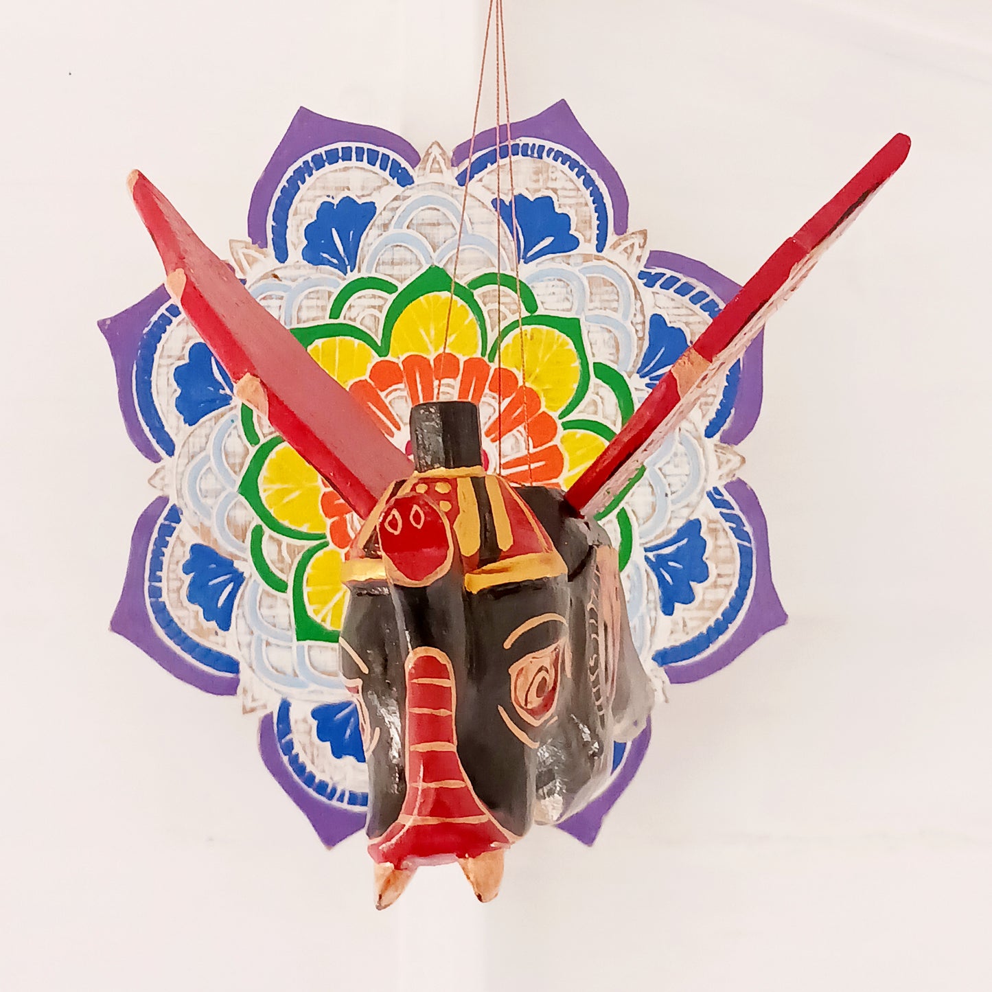 Bring a touch of wonder to your space with this enchanting Flying Elephant Mobile. Each piece is hand-carved from lightweight wood and finished with unique hand-painted patterns, giving every elephant its own personality. Delicately balanced wings hover gracefully with the slightest breeze, creating a calming sense of motion and magic.