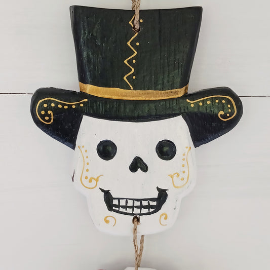 Hand-painted Day of the Dead skeleton inspired by Mexican calaveras. Handmade in Bali. A unique decorative piece for home or Día de los Muertos.