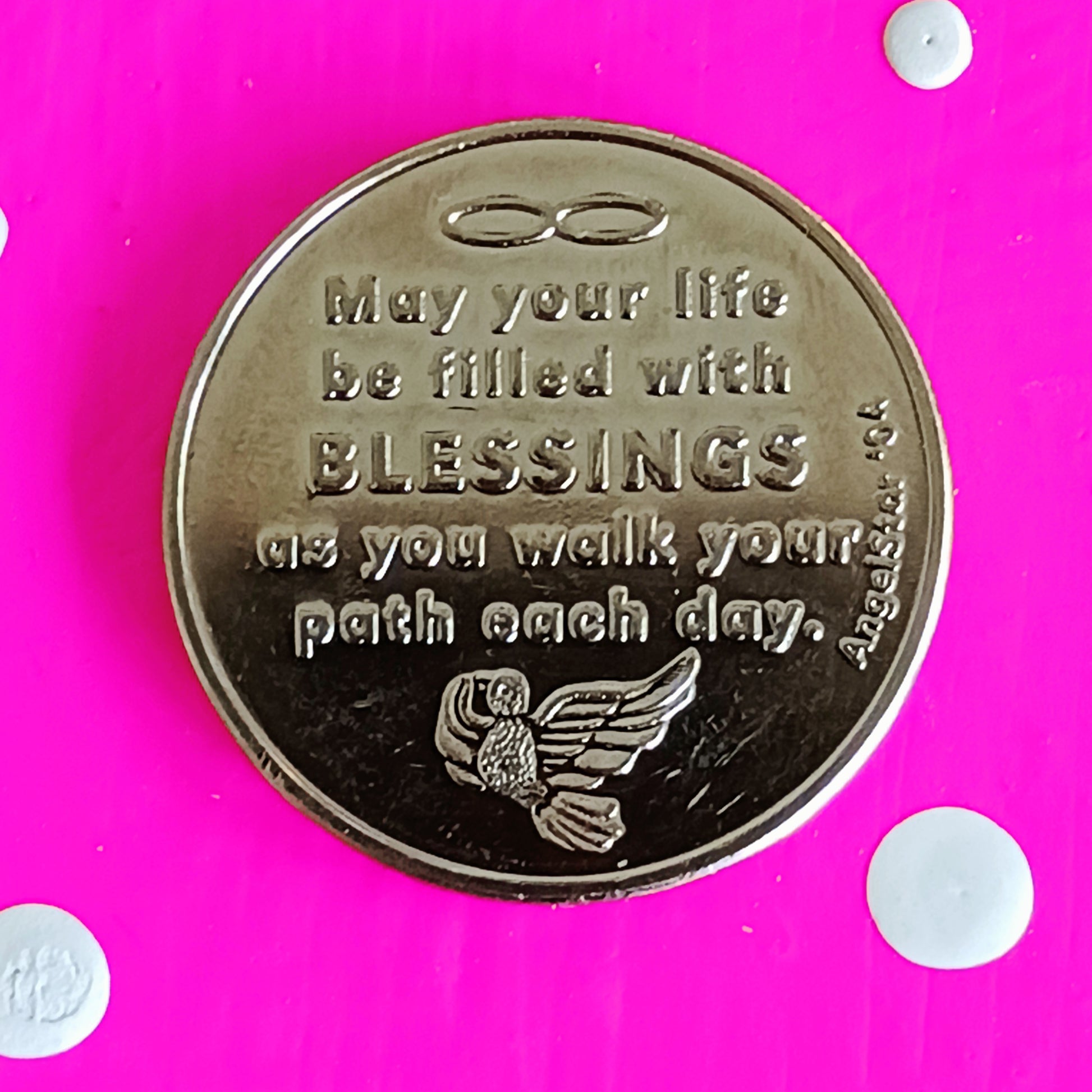 This Blessing Angel coin, whether given or received, conveys its angel blessing on you.  The front of the coin shows a kneeling angel with the inscription Blessing Coin. The reverse depicts a dove and the message "May your life be filled with Blessings as you walk your path each day".