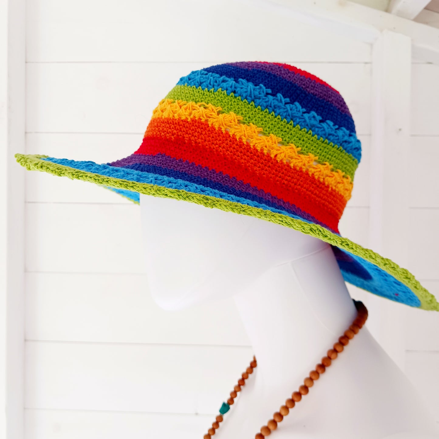 Handmade rainbow crochet sun hat with a flexible brim. Perfect for holidays, beach days & festivals. Unique, lightweight, and ready for sunny adventures!