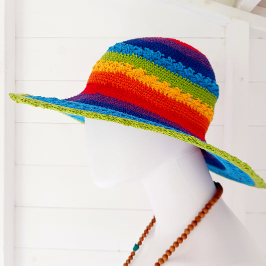 Handmade rainbow crochet sun hat with a flexible brim. Perfect for holidays, beach days & festivals. Unique, lightweight, and ready for sunny adventures!