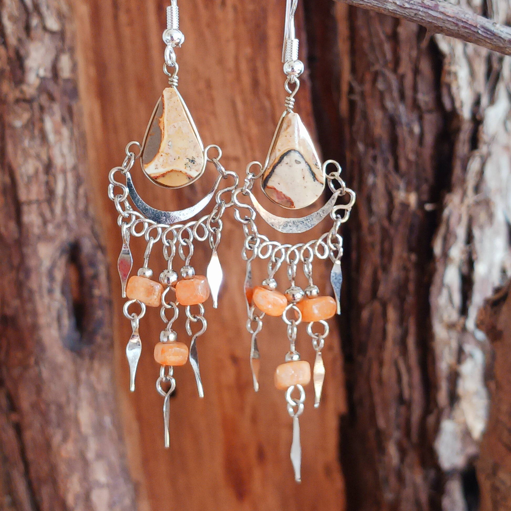 Add a touch of bohemian beauty to your look with these handmade Peruvian stone earrings. Featuring unique brown stones and finished with silver-plated hooks, each pair is carefully crafted in small workshops in Peru.
