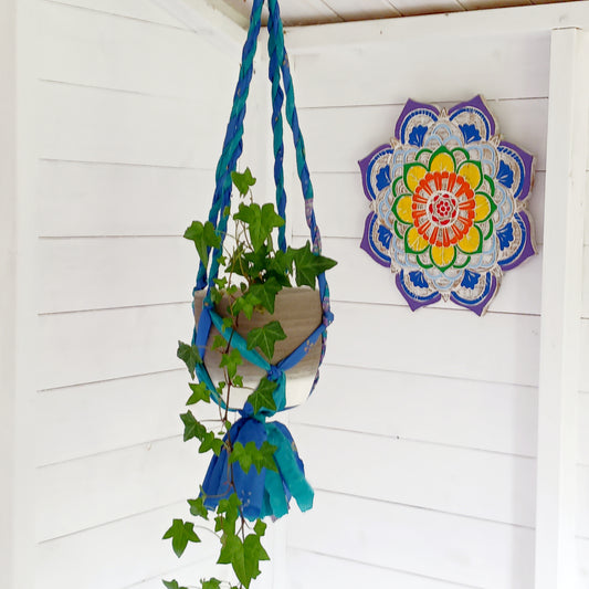 These beautiful sari plant hangers will add a splash of colour and boho chic to your home. Made from scraps of used sari, their simple design ensures that no fabric is wasted but is re-purposed into an elegant product. Featuring a strong metal ring for hanging.