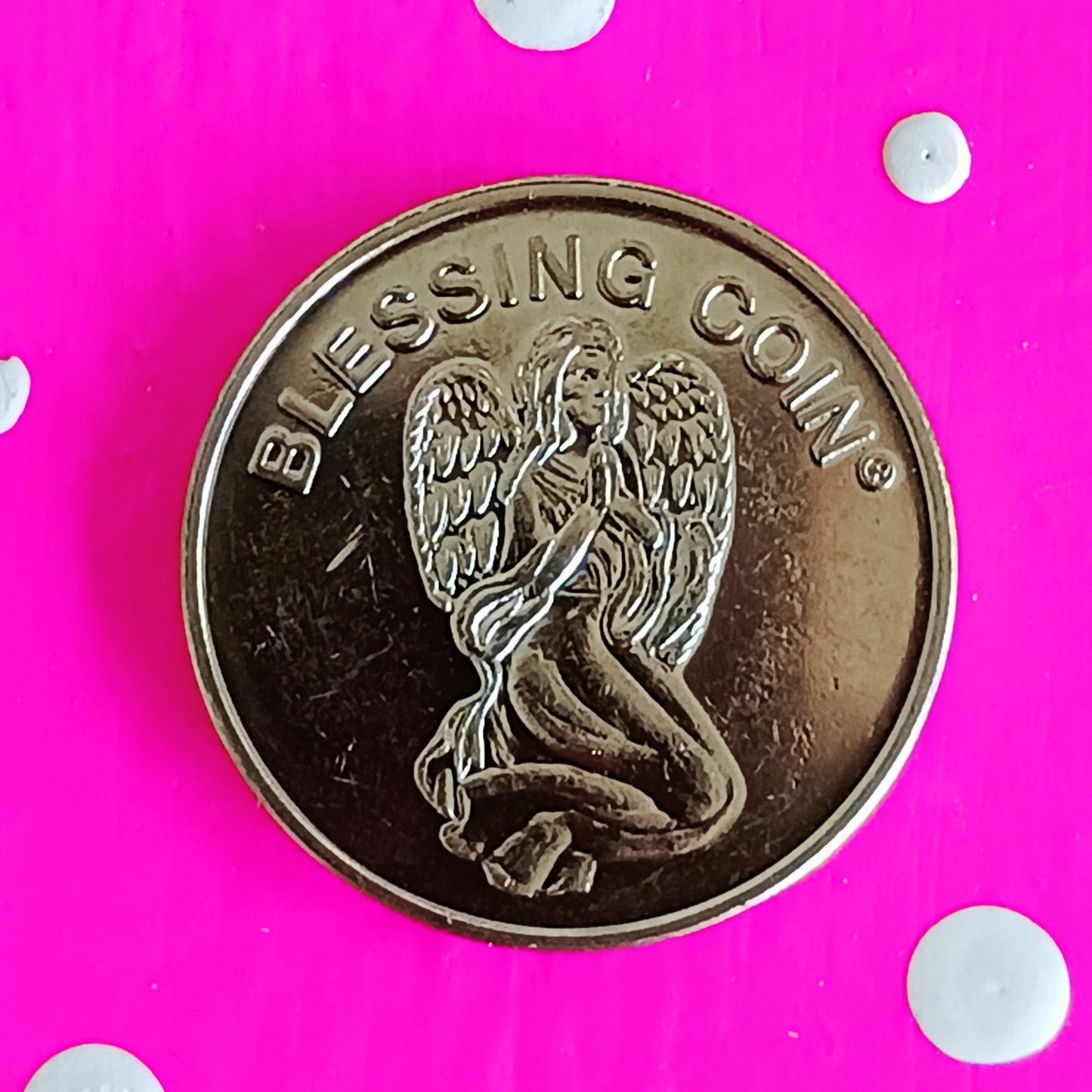 This Blessing Angel coin, whether given or received, conveys its angel blessing on you.  The front of the coin shows a kneeling angel with the inscription Blessing Coin. The reverse depicts a dove and the message "May your life be filled with Blessings as you walk your path each day".