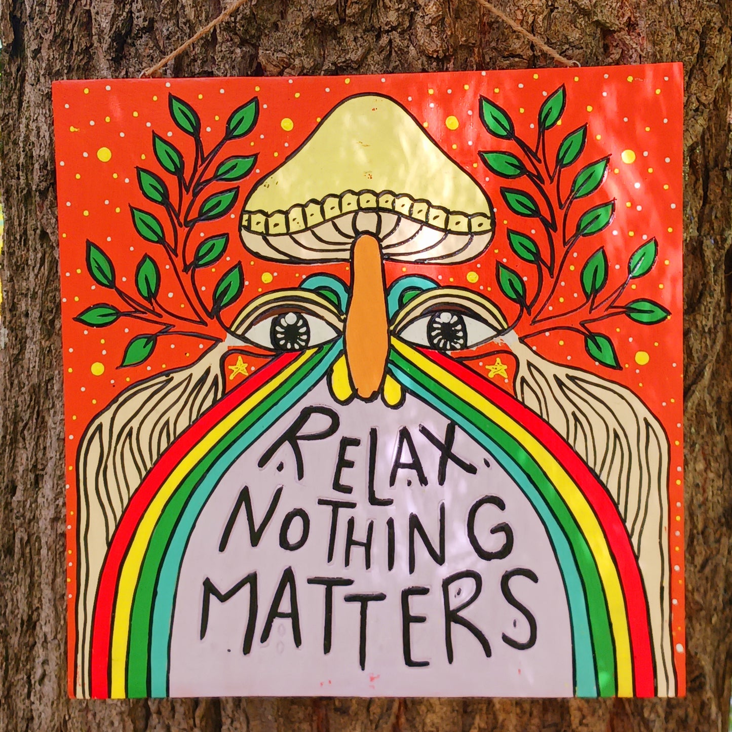 Add a splash of colour and carefree charm to your space with this Relax Nothing Matters Wall Plaque. Handmade by skilled artisans in Indonesia, this standout piece features a vibrant rainbow and whimsical mushroom in an abstract design.