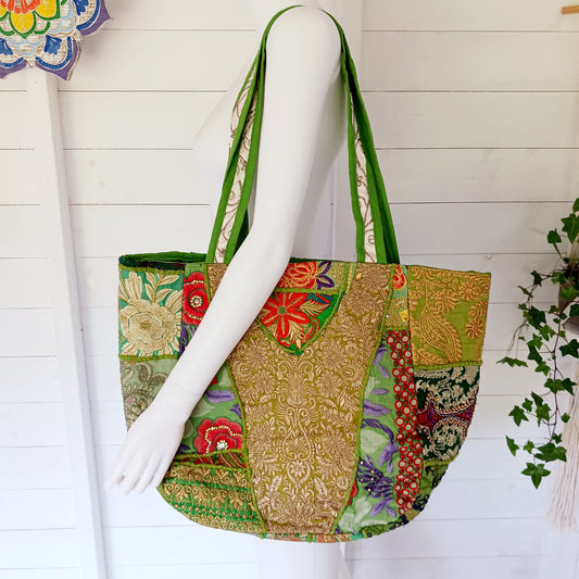 This beautiful large Indian bag comes with a wide shoulder strap and plenty of space inside for your personal items. In a patchwork style design, this bag is intricately embroidered with a traditional bohemian pattern. The bag is fully lined throughout.