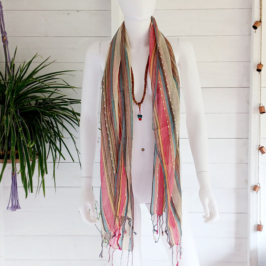 Immerse yourself in the alluring world of bohemian fashion with this delicate Indian Boho Scarf. Crafted with care, each scarf captures the essence of India's free-spirited charm, adding a touch of Boho elegance to your outfit. Whether draped effortlessly over your shoulders, wrapped as a headscarf, or styled with creative knots, this versatile accessory enhances your everyday fashion. Lightweight, breathable, and full of personality, it’s the perfect way to express your unique style.